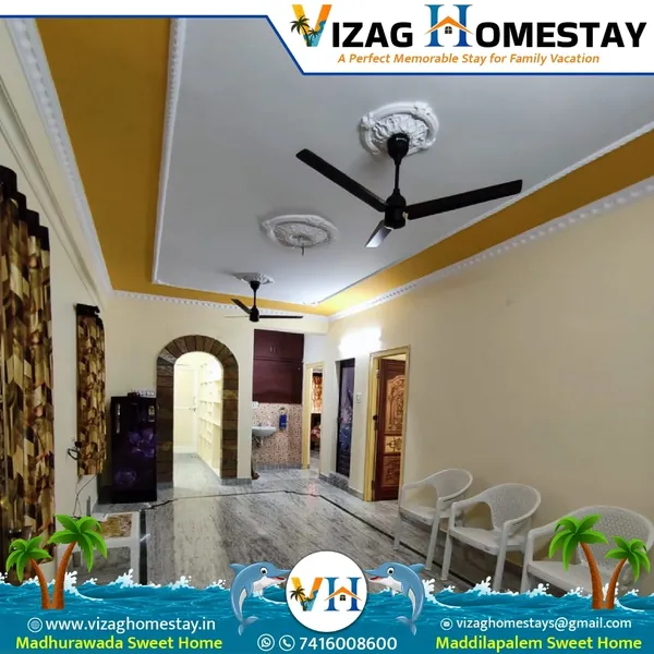Spacious living hall with TV and fridge at Vizag Homestay